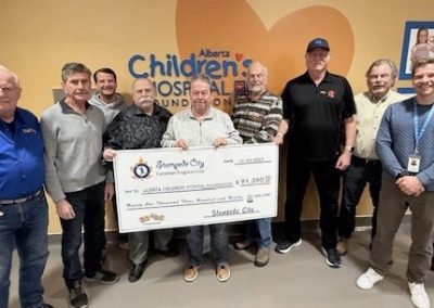 The boys from Stampede City CPC are presenting their 2025 annual contribution to the Brain Computer Interface Program—a total donation of $91,300.00 It could not have been possible without the help of all the wonderful people who support the Stampede City Progress Club.